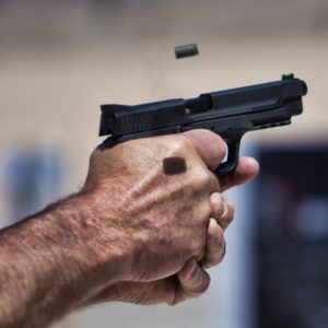 img of someone shooting a gun