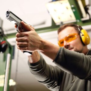 img of someone shooting a gun