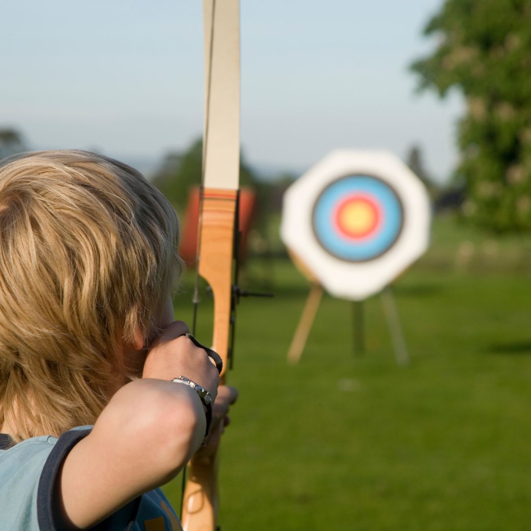 child shooting a bow
