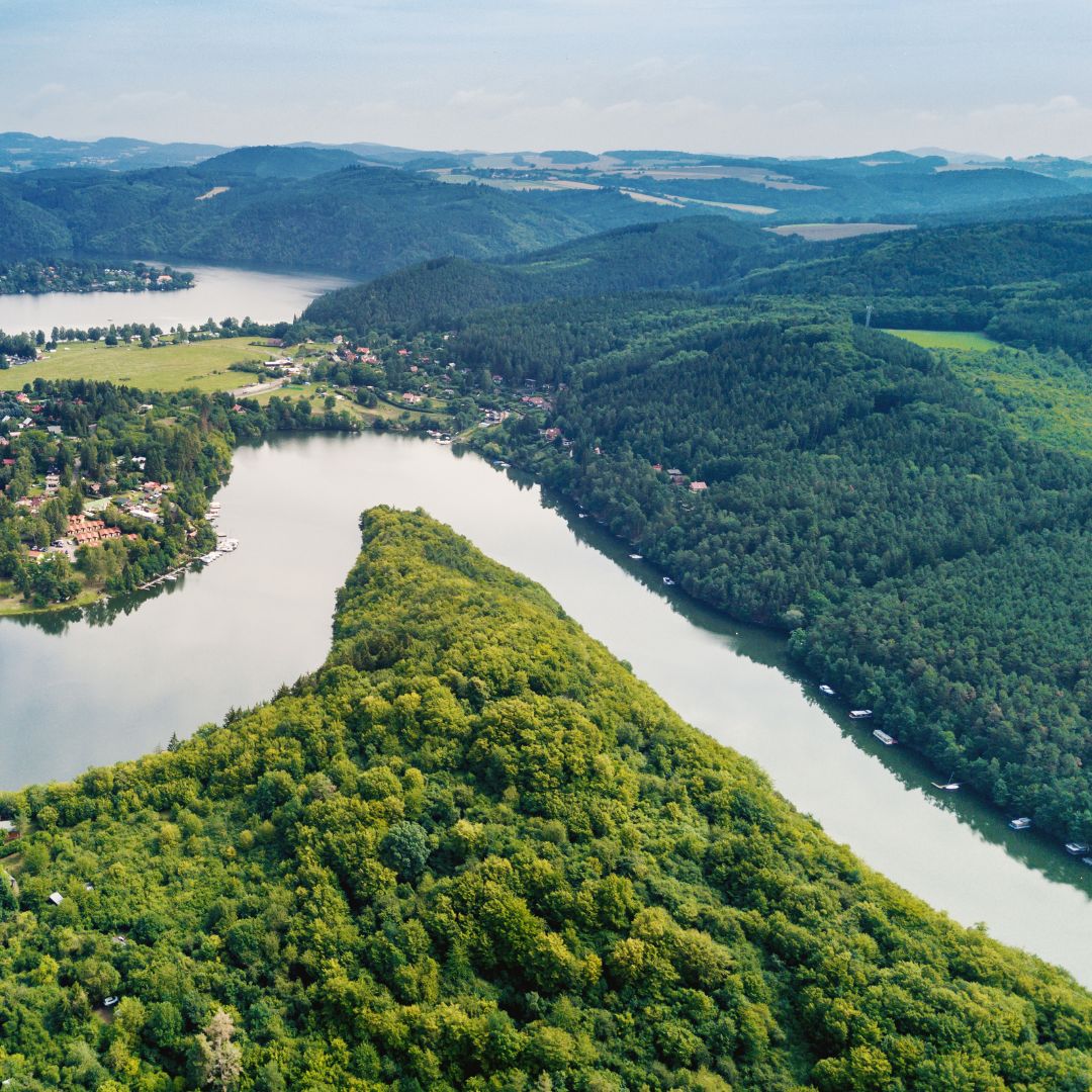 a sky view of a forest and river