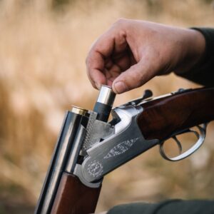 Hand loading a shotgun