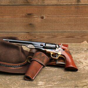 Colt pistol resting on a hat
