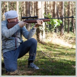 man shooting a guns